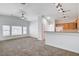 Bright living room featuring carpet floors and access to the kitchen at 5521 Jackpot Winner Ln # 101, Las Vegas, NV 89122