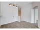 Living room with carpet floors, neutral walls, and modern lighting fixtures at 5521 Jackpot Winner Ln # 101, Las Vegas, NV 89122