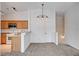 Bright living room with carpeted floors connects to a kitchen at 5521 Jackpot Winner Ln # 101, Las Vegas, NV 89122