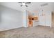 Open-concept living space featuring carpet floors and ample lighting at 5521 Jackpot Winner Ln # 101, Las Vegas, NV 89122
