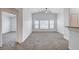 Spacious living room offering neutral walls and carpet flooring at 5521 Jackpot Winner Ln # 101, Las Vegas, NV 89122