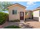 A cute backyard featuring desert landscaping, privacy wall, and small structure in the yard at 5601 Mackenzie Park Ct, Las Vegas, NV 89130