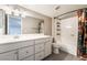 Bathroom features a shower-tub combo, single sink vanity, and modern fixtures at 5601 Mackenzie Park Ct, Las Vegas, NV 89130