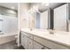 Bathroom featuring double sinks, a large mirror and modern fixtures at 5601 Mackenzie Park Ct, Las Vegas, NV 89130