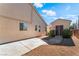 This home features a detached garage, backyard access, and low-maintenance desert landscaping at 5601 Mackenzie Park Ct, Las Vegas, NV 89130