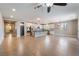 Open-concept living space features tile flooring and seamlessly connects to the kitchen at 5601 Mackenzie Park Ct, Las Vegas, NV 89130