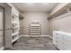 An organized walk-in closet with ample shelving and drawers for storage at 5601 Mackenzie Park Ct, Las Vegas, NV 89130