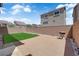 Low-maintenance backyard with artificial grass, patio, and privacy fence at 5616 Canoe Ridge Ct, Las Vegas, NV 89141