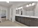 Bathroom with double vanity, ample counter space, and walk-in shower at 5616 Canoe Ridge Ct, Las Vegas, NV 89141