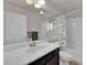 Bright bathroom with a vanity with drawers and shower-tub combination at 5616 Canoe Ridge Ct, Las Vegas, NV 89141
