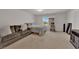 Comfortable bedroom with a couch, bed, and natural light from the window at 5616 Canoe Ridge Ct, Las Vegas, NV 89141