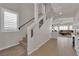 Bright stairway leading to the living area with neutral tones and modern railing at 5616 Canoe Ridge Ct, Las Vegas, NV 89141