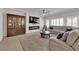 Cozy living room features a fireplace, large television, and comfortable seating for relaxation at 5616 Canoe Ridge Ct, Las Vegas, NV 89141