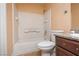 Bathroom with tub and shower combo, dark wood vanity, and tile flooring at 6800 E Lake Mead Blvd # 2076, Las Vegas, NV 89156