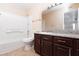 Bathroom with tiled shower and granite countertop at 6800 E Lake Mead Blvd # 2076, Las Vegas, NV 89156