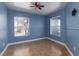 A simple bedroom with tile floors and two windows creates a well-lit space at 6800 E Lake Mead Blvd # 2076, Las Vegas, NV 89156