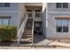 Exterior shot of building entrance with stairs leading to the second floor at 6800 E Lake Mead Blvd # 2076, Las Vegas, NV 89156