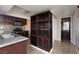 A kitchen features dark cabinets, stainless steel appliances, and a granite countertop at 6800 E Lake Mead Blvd # 2076, Las Vegas, NV 89156