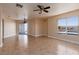 Spacious living area features tile flooring, chandelier, and large sliding glass doors at 6800 E Lake Mead Blvd # 2076, Las Vegas, NV 89156