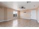 Neutral living room with large tile floor and window offering natural light at 6800 E Lake Mead Blvd # 2076, Las Vegas, NV 89156