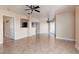 Open floor plan with tile flooring, ceiling fan, and access to sliding glass doors at 6800 E Lake Mead Blvd # 2076, Las Vegas, NV 89156