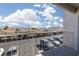 Balcony view of a parking lot with a mountain range in the distance at 6800 E Lake Mead Blvd # 2076, Las Vegas, NV 89156