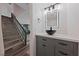 Bathroom with tile floors, stairs, modern vanity, vessel sink, and stylish lighting at 6999 Montcliff Ave, Las Vegas, NV 89147