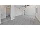 A bright bedroom with ceiling fan, en-suite bathroom and soft grey carpet at 6999 Montcliff Ave, Las Vegas, NV 89147