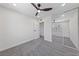 A bright bedroom with closet doors, ceiling fan, and soft grey carpet at 6999 Montcliff Ave, Las Vegas, NV 89147