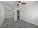 A bright bedroom with access to stairs, large mirrored closet doors and soft grey carpet at 6999 Montcliff Ave, Las Vegas, NV 89147