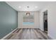 The dining room has neutral paint, recessed lighting, and a large window overlooking the sparkling pool at 6999 Montcliff Ave, Las Vegas, NV 89147