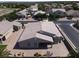 Aerial view of the home, featuring an expansive patio, lush landscaping, and tile roof at 7230 Fresh Harvest Ave, Las Vegas, NV 89131