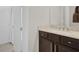 Bathroom with rich dark cabinets, light countertop, and tiled floors at 7230 Fresh Harvest Ave, Las Vegas, NV 89131