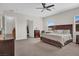 A bright bedroom boasts a bed with a dark headboard and cozy, neutral decor at 7230 Fresh Harvest Ave, Las Vegas, NV 89131