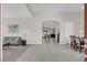 Bright open foyer with neutral tile flooring leading to dining and living areas at 7230 Fresh Harvest Ave, Las Vegas, NV 89131