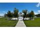 Beautifully landscaped gazebo surrounded by green lawns perfect for events or relaxation at 7230 Fresh Harvest Ave, Las Vegas, NV 89131