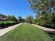 Well-manicured green space providing a serene view and a sense of openness in a community setting at 7230 Fresh Harvest Ave, Las Vegas, NV 89131