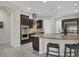 Open kitchen with stainless steel appliances and granite island, great for entertaining at 7230 Fresh Harvest Ave, Las Vegas, NV 89131