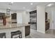 Spacious kitchen with stainless steel appliances, island and dark wood cabinetry at 7230 Fresh Harvest Ave, Las Vegas, NV 89131