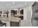 Gourmet kitchen with stainless steel appliances and custom dark wood cabinetry at 7230 Fresh Harvest Ave, Las Vegas, NV 89131