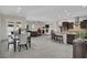 Spacious open-plan living space featuring kitchen, dining, and living areas at 7230 Fresh Harvest Ave, Las Vegas, NV 89131