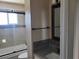 Updated bathroom featuring tiled shower/bathtub combination and granite vanity at 745 Greenbriar Townhouse Way, Las Vegas, NV 89121