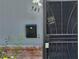 Charming front entrance featuring a mailbox and security door at 745 Greenbriar Townhouse Way, Las Vegas, NV 89121