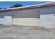 Spacious two car garage offering ample parking and storage, concrete driveway at 745 Greenbriar Townhouse Way, Las Vegas, NV 89121