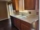 Cozy kitchen showcasing wooden cabinets and ample counter space at 745 Greenbriar Townhouse Way, Las Vegas, NV 89121