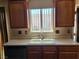 Well maintained kitchen featuring a modern sink and countertops at 745 Greenbriar Townhouse Way, Las Vegas, NV 89121