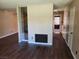 An open living area features vinyl flooring and a decorative accent wall at 745 Greenbriar Townhouse Way, Las Vegas, NV 89121