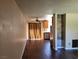A large, open concept living area with wood floors and natural light at 745 Greenbriar Townhouse Way, Las Vegas, NV 89121