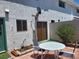 Brick patio with table and chairs at 745 Greenbriar Townhouse Way, Las Vegas, NV 89121