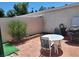 Brick patio with table and chairs at 745 Greenbriar Townhouse Way, Las Vegas, NV 89121